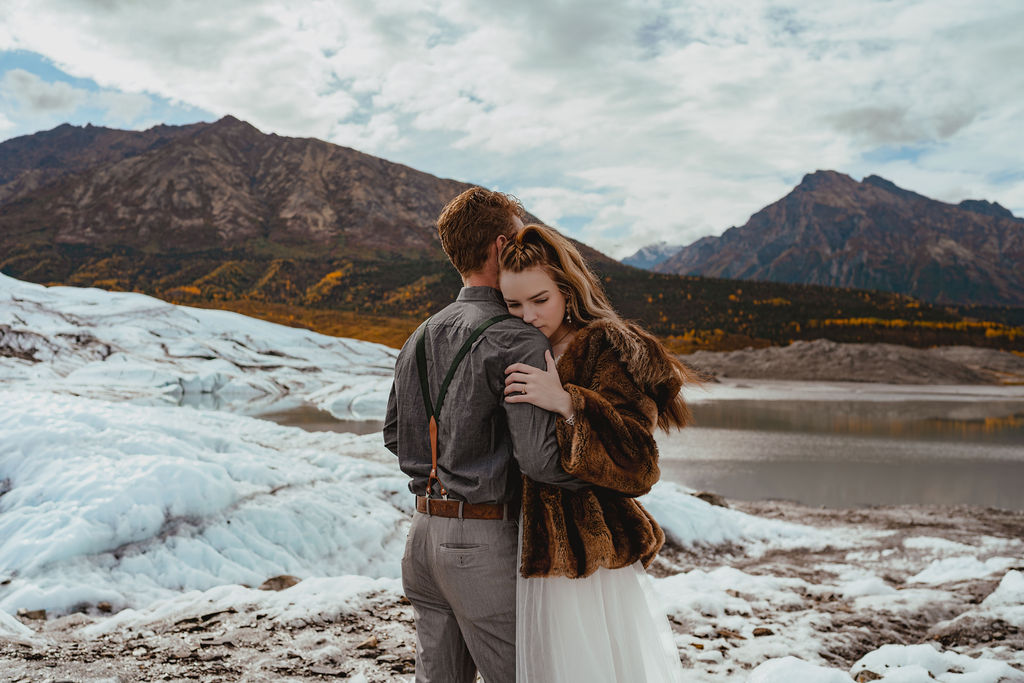 Couple getting married on glacier in alaska
