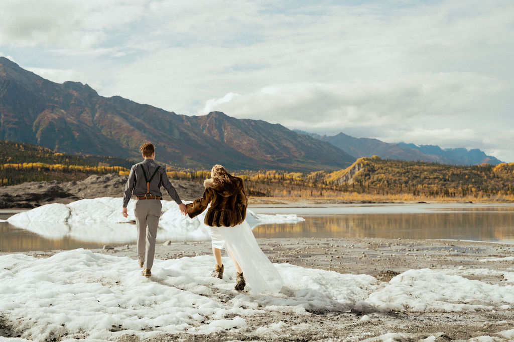 Couple holding hands and walking ar Matanuska Glacier Tours